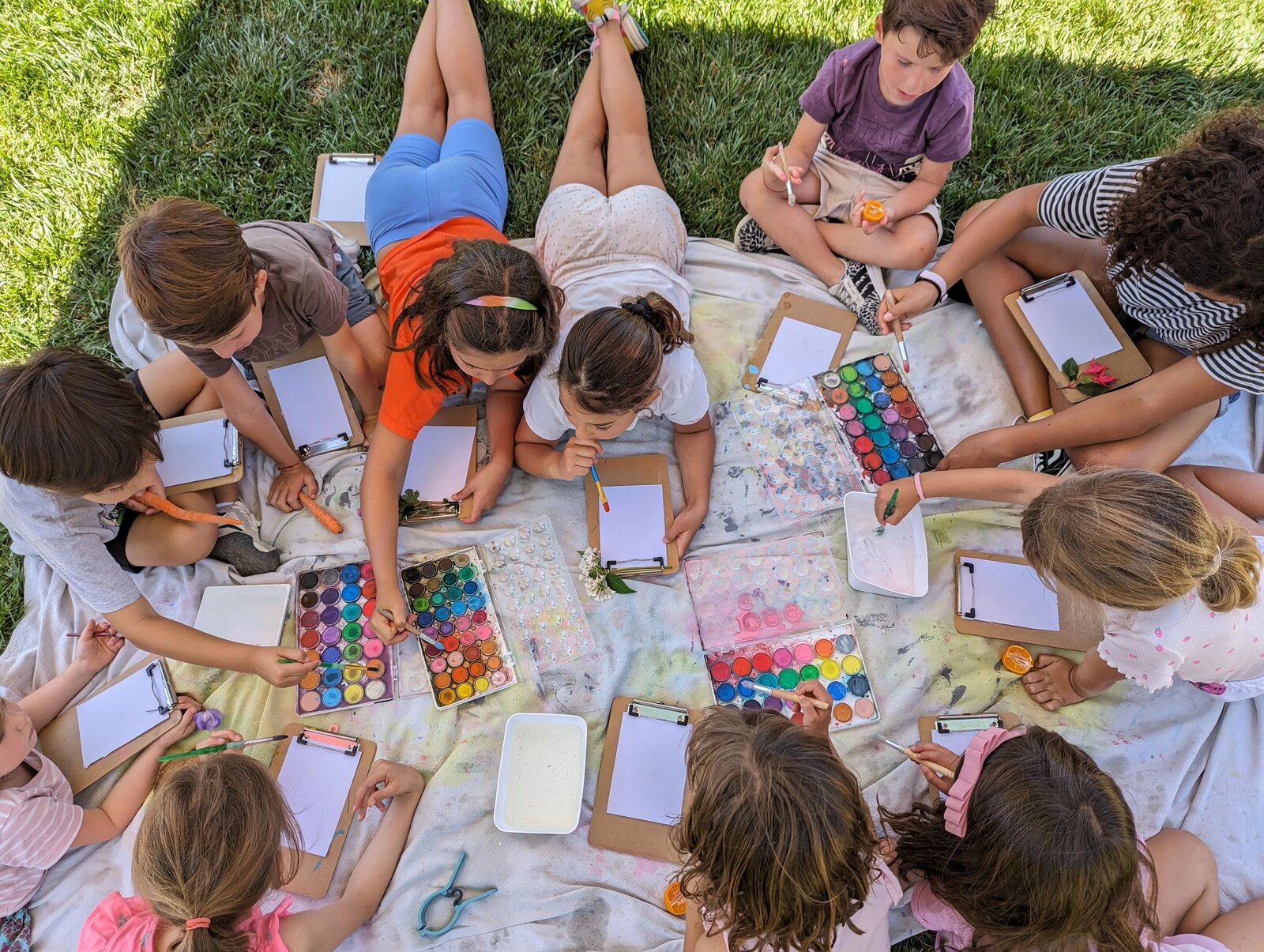 Children making art outdoors at Pachis art studio in Linda Vista, San Diego